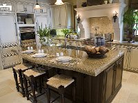 Luxury home kitchen with a granite island.